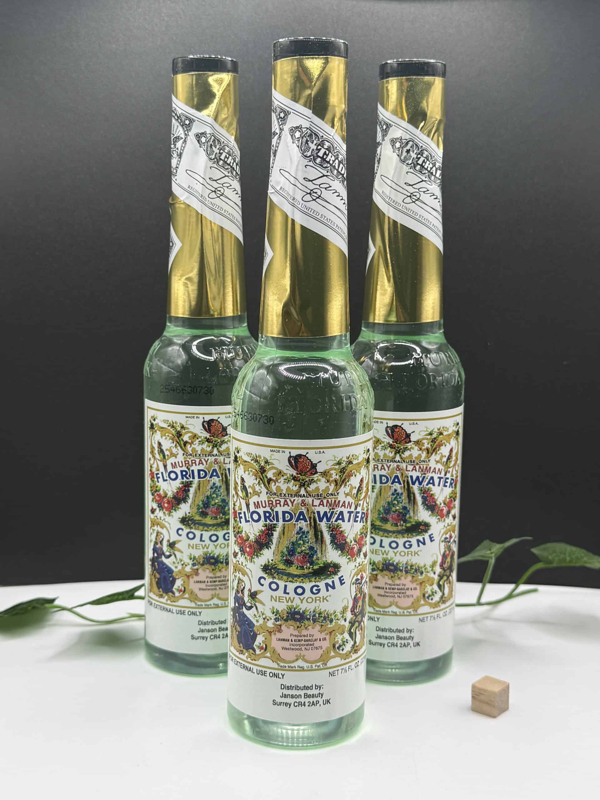 Bottles of Florida Water cologne with decorative labels, used for spiritual cleansing and refreshing purposes.