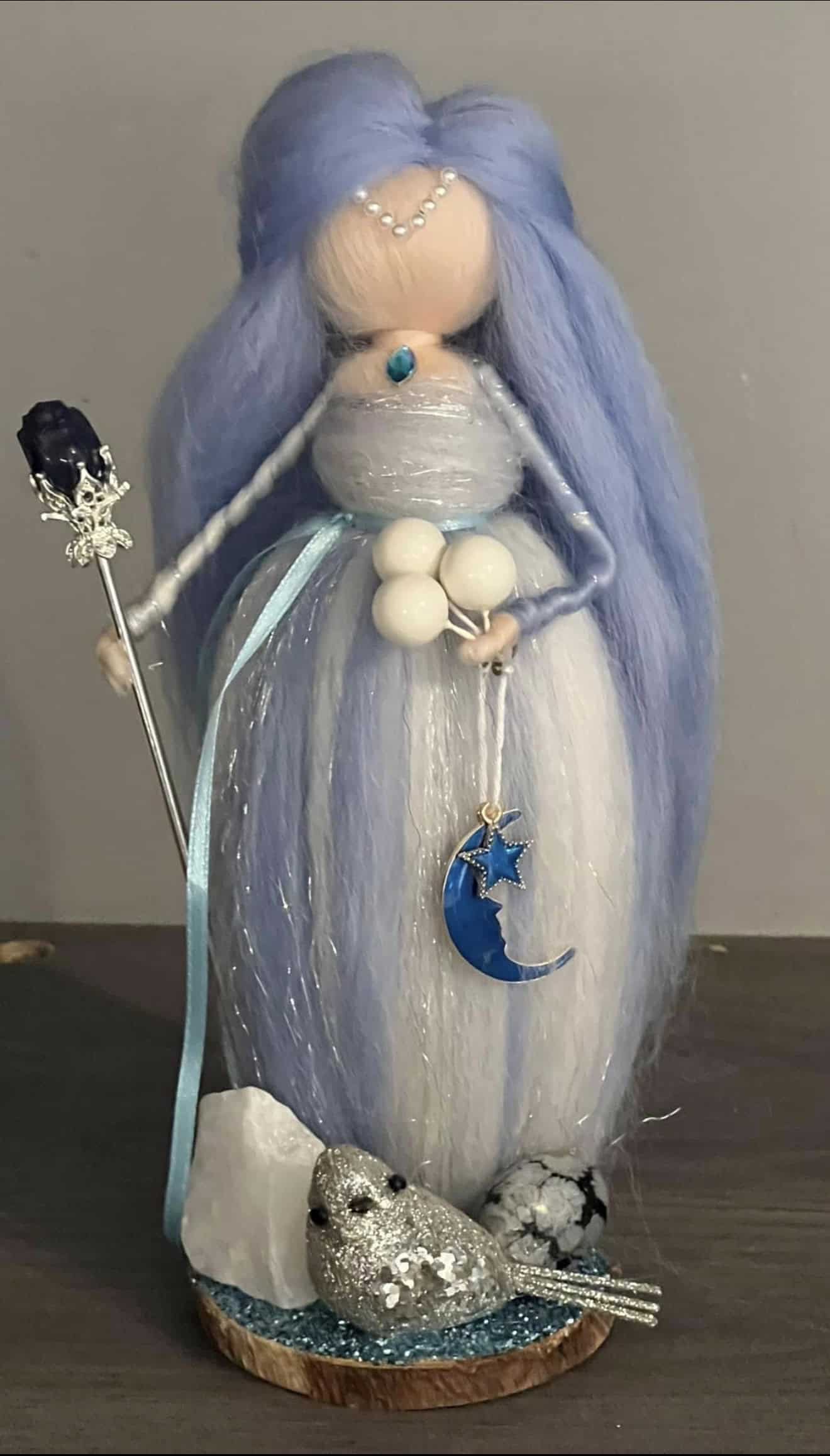 An enchanting fairy doll with long lavender hair, a silver dress, and celestial accessories including a moon and star charm, perfect for spiritual or decorative purposes.