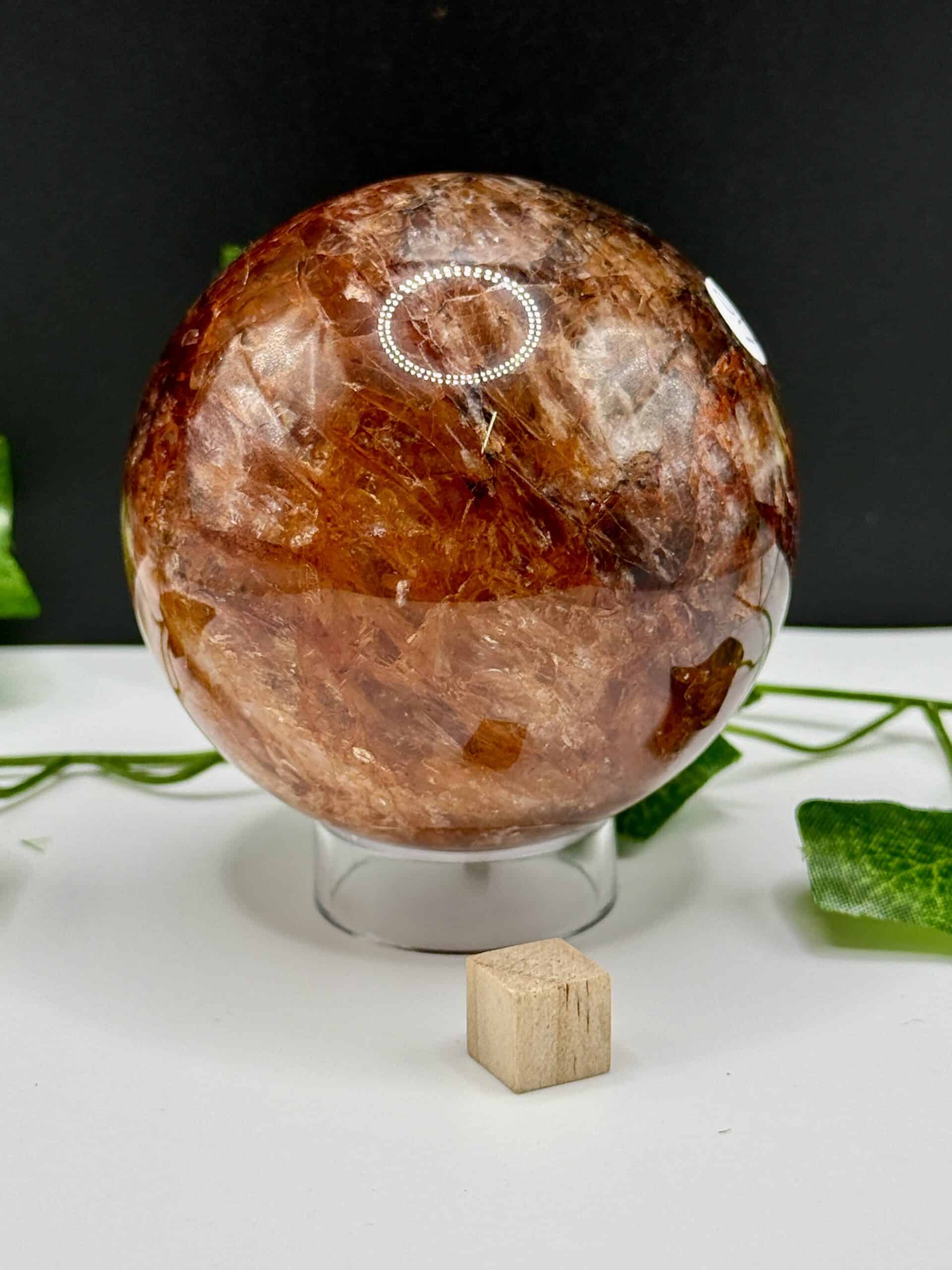 Natural brown quartz crystal sphere for healing and meditation, showcasing polished surface and unique mineral patterns, ideal for spiritual practices and energy balancing.