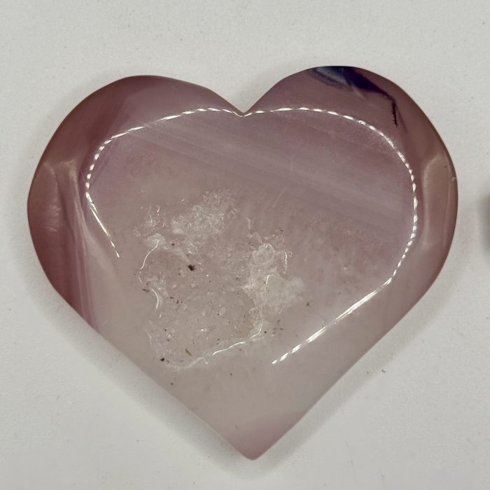 Rose quartz heart-shaped crystal for healing and spiritual wellness.