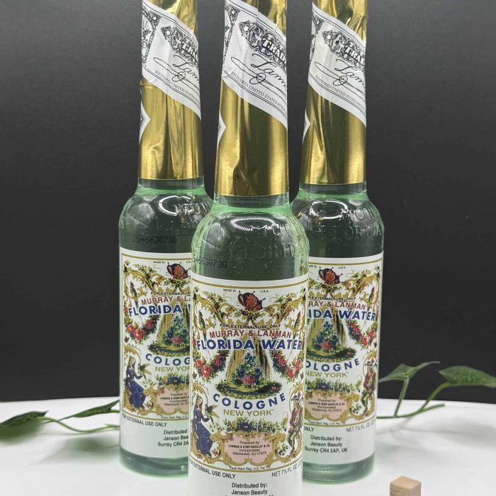 Bottles of Florida Water cologne with decorative labels, used for spiritual cleansing and refreshing purposes.